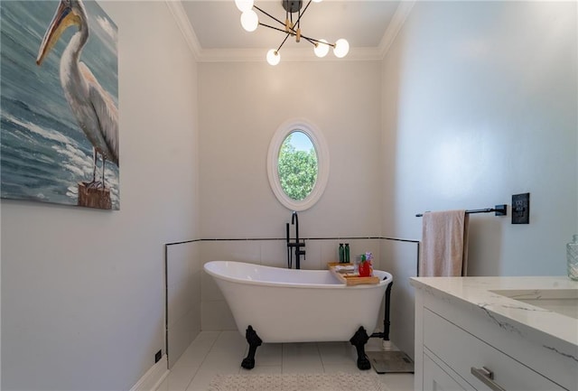 full bathroom with crown molding, a soaking tub, vanity, tile patterned flooring, and a chandelier