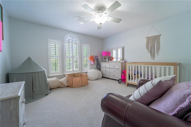 carpeted bedroom with a ceiling fan