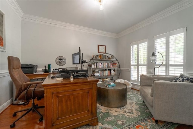 office area with ornamental molding and wood finished floors