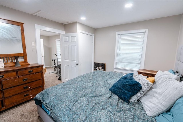 carpeted bedroom featuring a closet