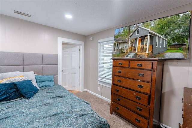 bedroom with light carpet