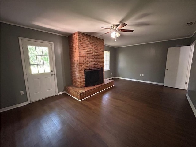 unfurnished living room with crown molding and a healthy amount of sunlight