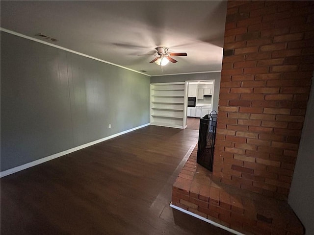 unfurnished living room featuring crown molding, baseboards, a ceiling fan, and dark wood-style floors
