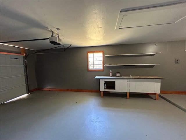 garage featuring baseboards and a garage door opener
