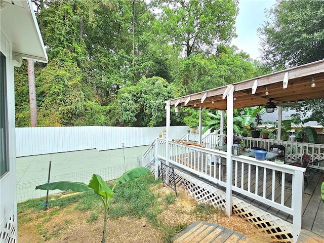 view of yard with a deck and a pergola