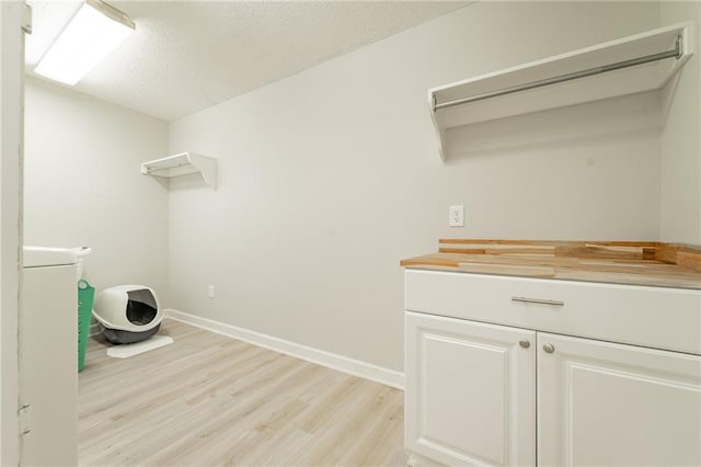 laundry area featuring light hardwood / wood-style floors