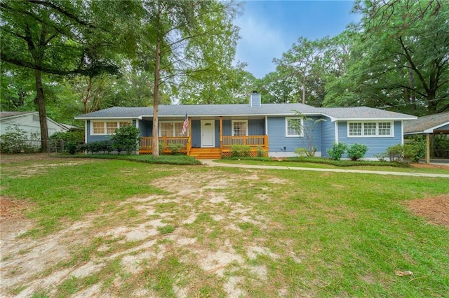 single story home with a front yard and a porch