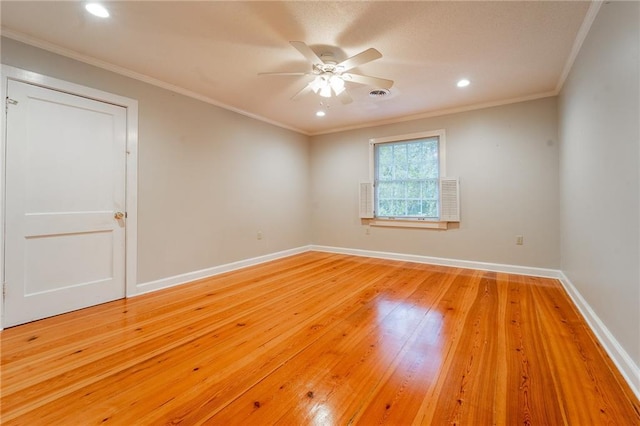 unfurnished room with ceiling fan, light hardwood / wood-style floors, and ornamental molding