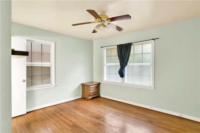 unfurnished room featuring light hardwood / wood-style flooring and ceiling fan