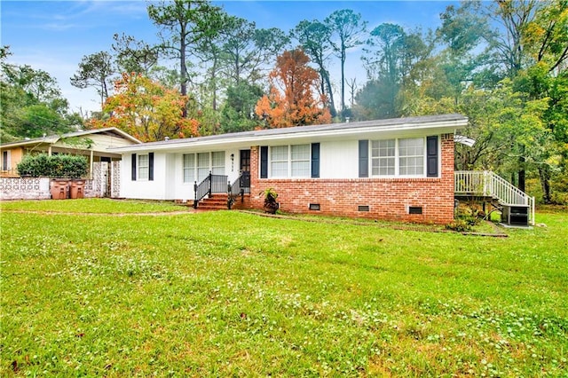 ranch-style house featuring a front lawn