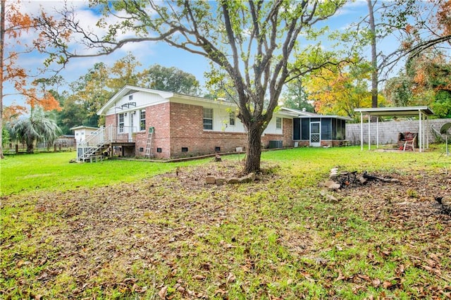 view of yard with a sunroom