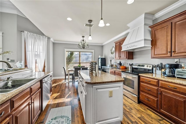 kitchen featuring sink, appliances with stainless steel finishes, ornamental molding, custom range hood, and a kitchen island