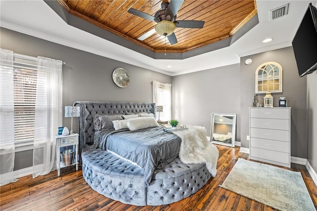 bedroom with crown molding, ceiling fan, dark hardwood / wood-style floors, a tray ceiling, and wooden ceiling