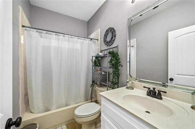 full bathroom with vanity, shower / tub combo with curtain, and toilet