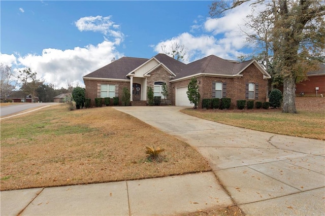 single story home with a garage and a front yard