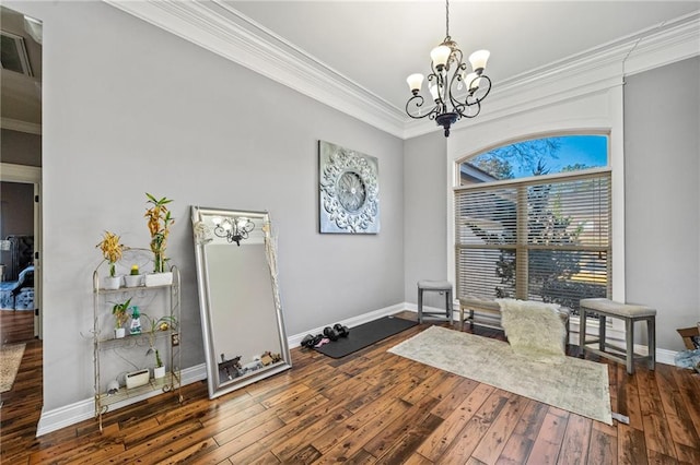 interior space featuring dark wood-type flooring, crown molding, and a notable chandelier