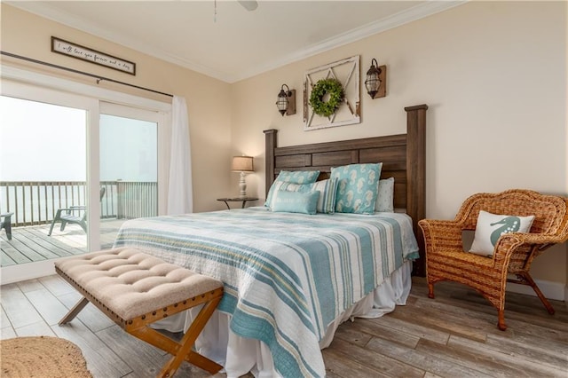 bedroom featuring crown molding, access to outside, and hardwood / wood-style flooring