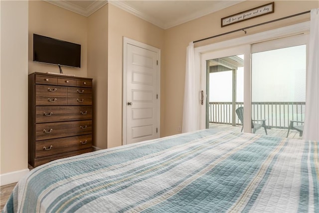 bedroom featuring crown molding and access to outside