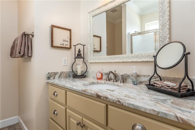 bathroom featuring vanity and ornamental molding