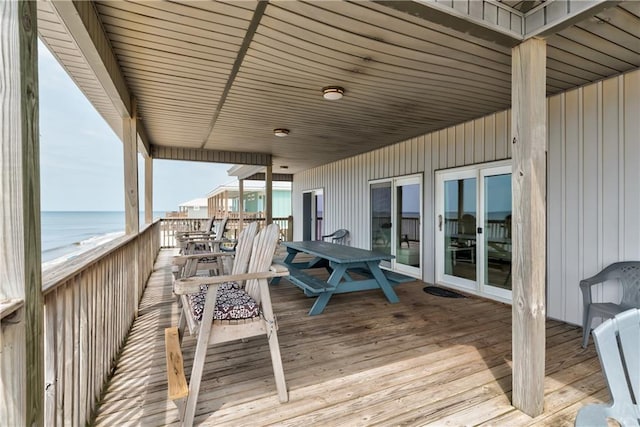 wooden deck featuring a water view