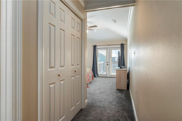 528 Lemoyne Dr Unit 2C, Dauphin Island, AL 36528 - hallway with dark carpet and crown molding