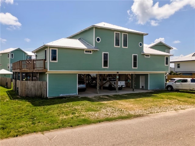 528 Lemoyne Dr Unit 2C, Dauphin Island, AL 36528 - back of property featuring a carport and a metal roof