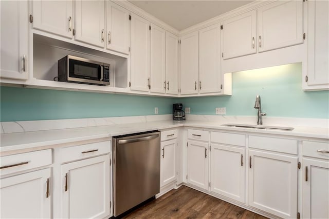 528 Lemoyne Dr Unit 2C, Dauphin Island, AL 36528 - kitchen with stainless steel appliances, white cabinets, and dark wood-style floors