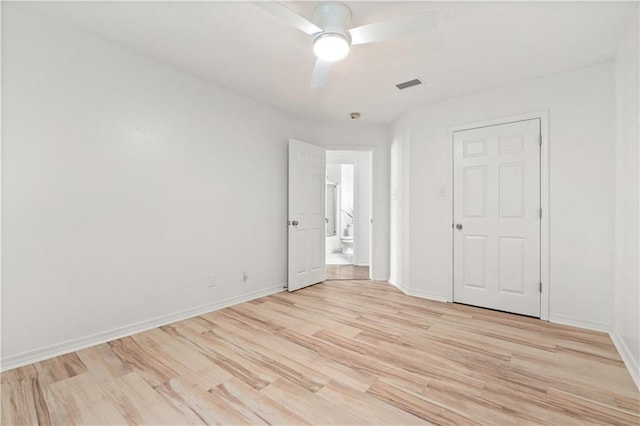 unfurnished bedroom featuring light wood-type flooring, a closet, and ceiling fan