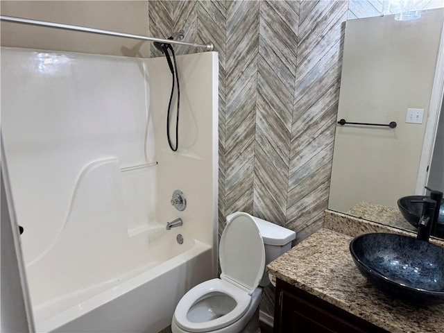 full bathroom featuring vanity, toilet, and tub / shower combination