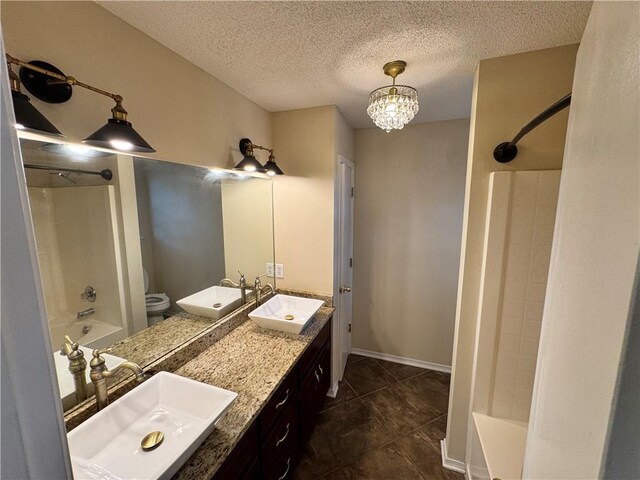 full bathroom with a textured ceiling, toilet, vanity, a notable chandelier, and shower / bath combination