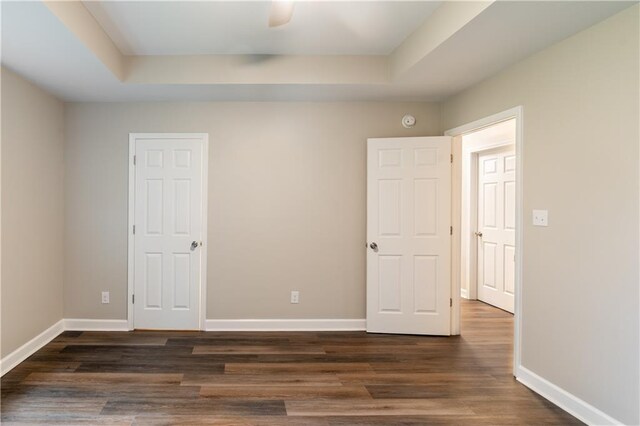 hallway featuring dark hardwood / wood-style flooring