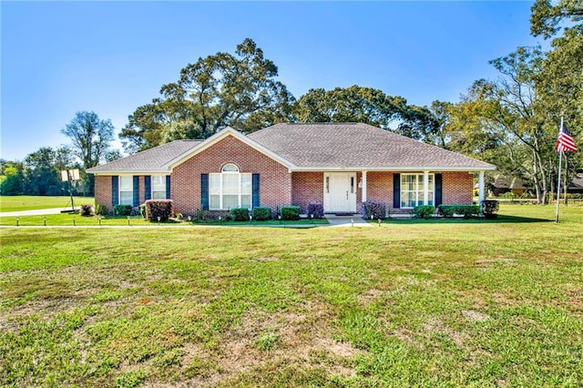 ranch-style home featuring a front yard