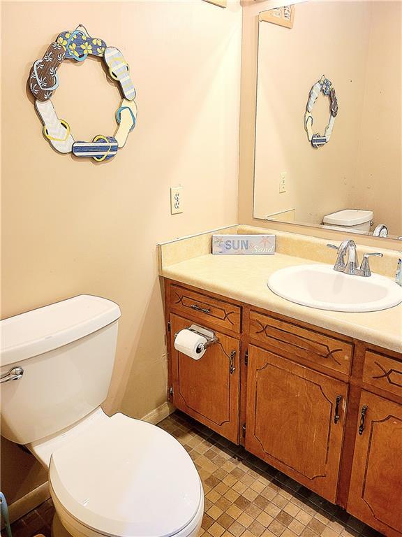 bathroom featuring vanity and toilet