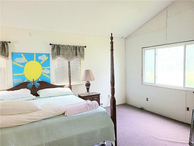 carpeted bedroom featuring vaulted ceiling