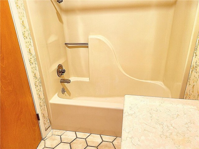 bathroom featuring shower / bath combination and tile patterned floors