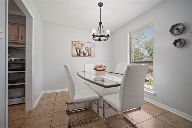 1120 Abilene Dr W, Mobile, AL 36695 - tiled dining area featuring a chandelier and baseboards