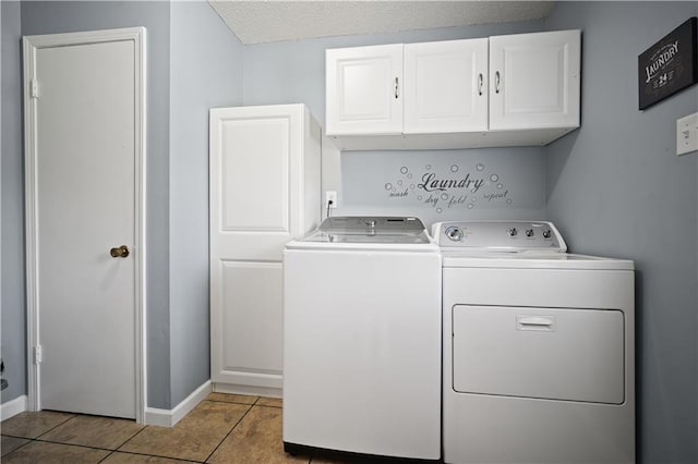 1120 Abilene Dr W, Mobile, AL 36695 - laundry room featuring cabinet space, separate washer and dryer, light tile patterned floors, and a textured ceiling
