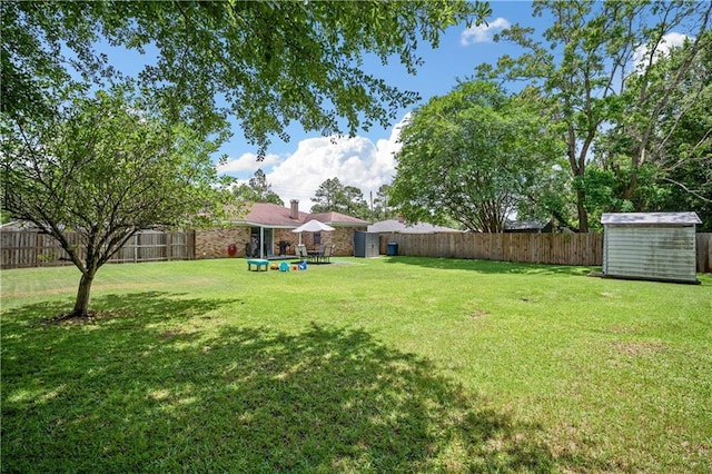 1120 Abilene Dr W, Mobile, AL 36695 - fenced backyard with a storage shed