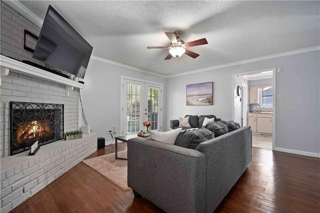 1120 Abilene Dr W, Mobile, AL 36695 - living area with ceiling fan, a fireplace, wood finished floors, healthy amount of natural light, and crown molding
