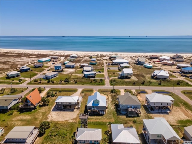 bird's eye view featuring a beach view and a water view