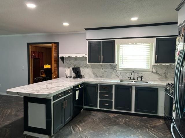 kitchen featuring sink, decorative backsplash, kitchen peninsula, and black appliances