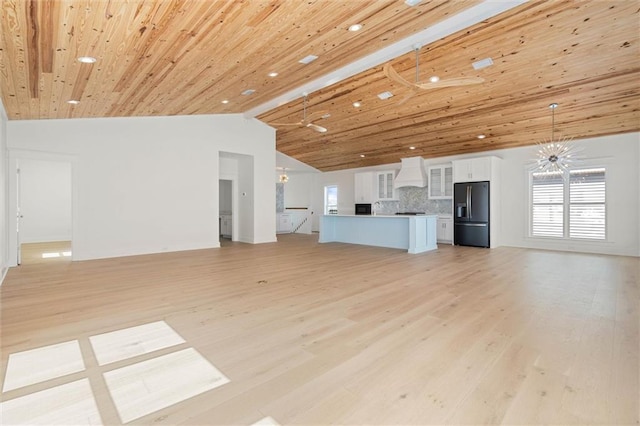2626 Bridgeview Dr, Dauphin Island, AL 36528 - unfurnished living room with vaulted ceiling, light wood-style flooring, recessed lighting, and plenty of natural light
