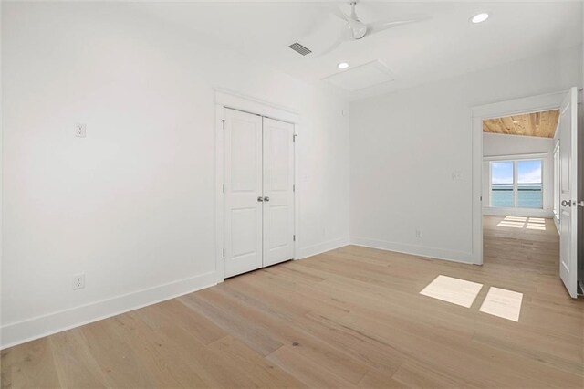 2626 Bridgeview Dr, Dauphin Island, AL 36528 - unfurnished bedroom featuring light wood-style flooring, recessed lighting, and a closet