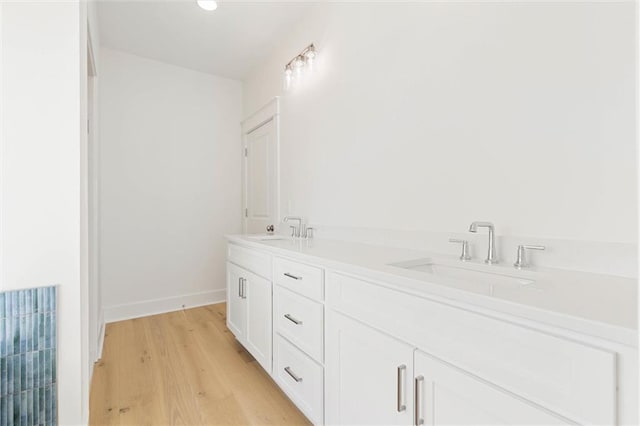 2626 Bridgeview Dr, Dauphin Island, AL 36528 - full bathroom featuring wood finished floors, double vanity, and recessed lighting