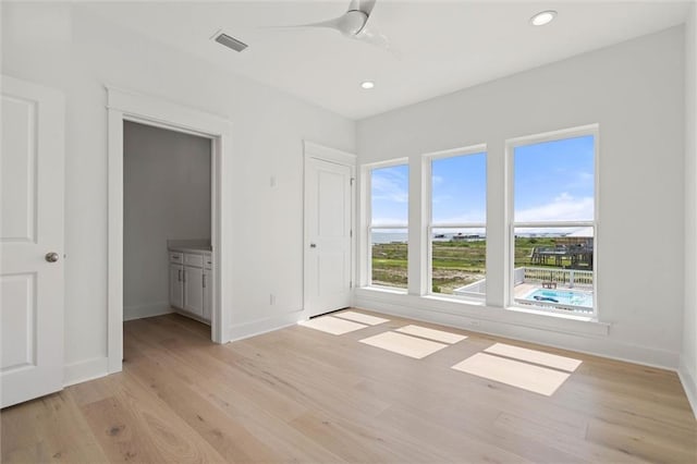 2626 Bridgeview Dr, Dauphin Island, AL 36528 - unfurnished bedroom featuring light wood-type flooring, recessed lighting, and a ceiling fan