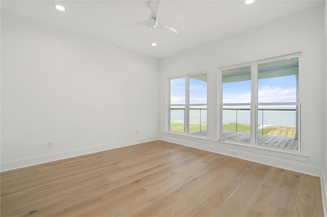 2626 Bridgeview Dr, Dauphin Island, AL 36528 - spare room with light wood finished floors, recessed lighting, a water view, and ceiling fan