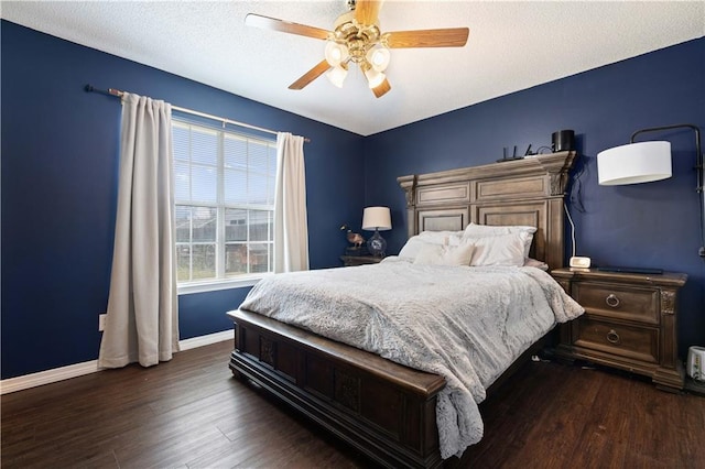 bedroom featuring a textured ceiling, dark hardwood / wood-style flooring, and ceiling fan