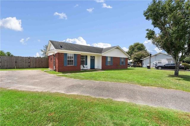 ranch-style home with a front yard