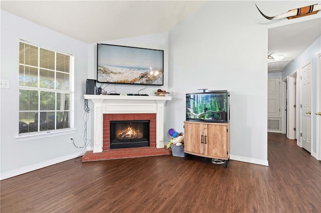 unfurnished living room with a fireplace and dark hardwood / wood-style flooring