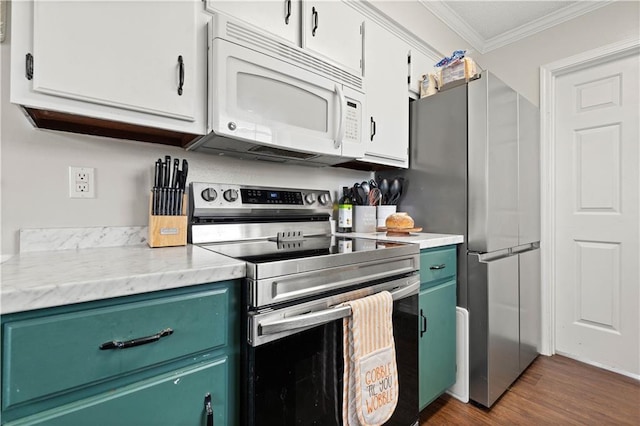 kitchen with white cabinets, stainless steel appliances, dark wood-type flooring, and crown molding